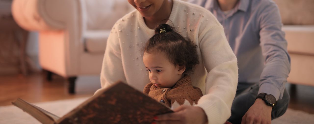 Parents reading to child